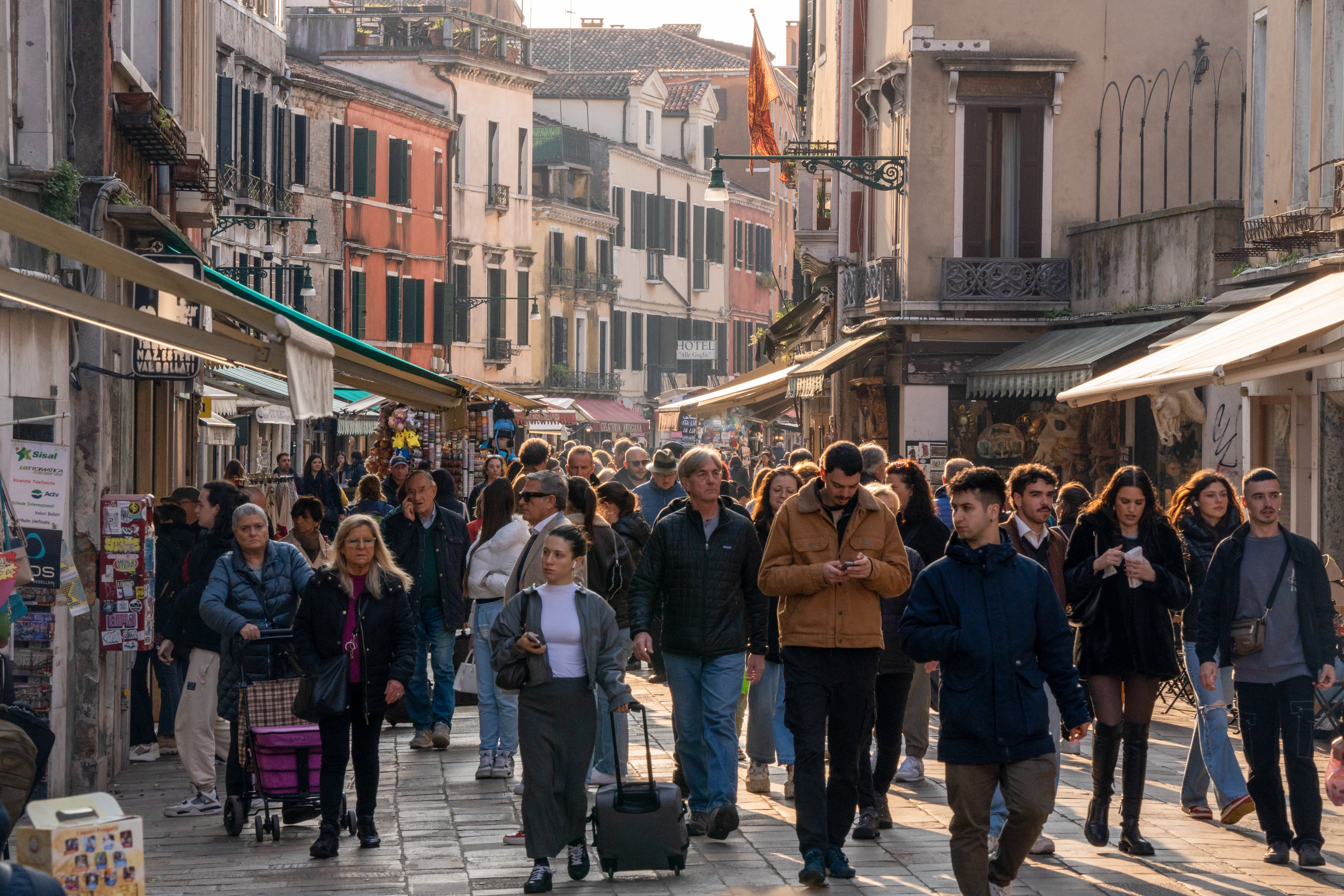 Tourists are flocking to Italy in unprecedented numbers, but the country is struggling to manage the influx.