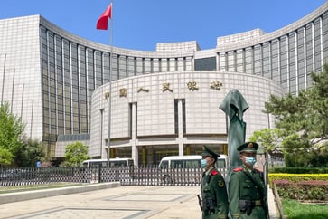 Experts predict that China's monetary shift may indicate economic concerns, but a "bazooka-style" stimulus is unlikely to be implemented.