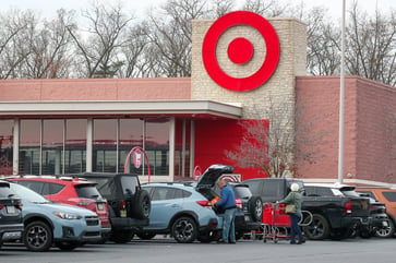 After a discounter cuts its forecast, Target experiences a 20% decline in shares and posts its largest earnings miss in two years.