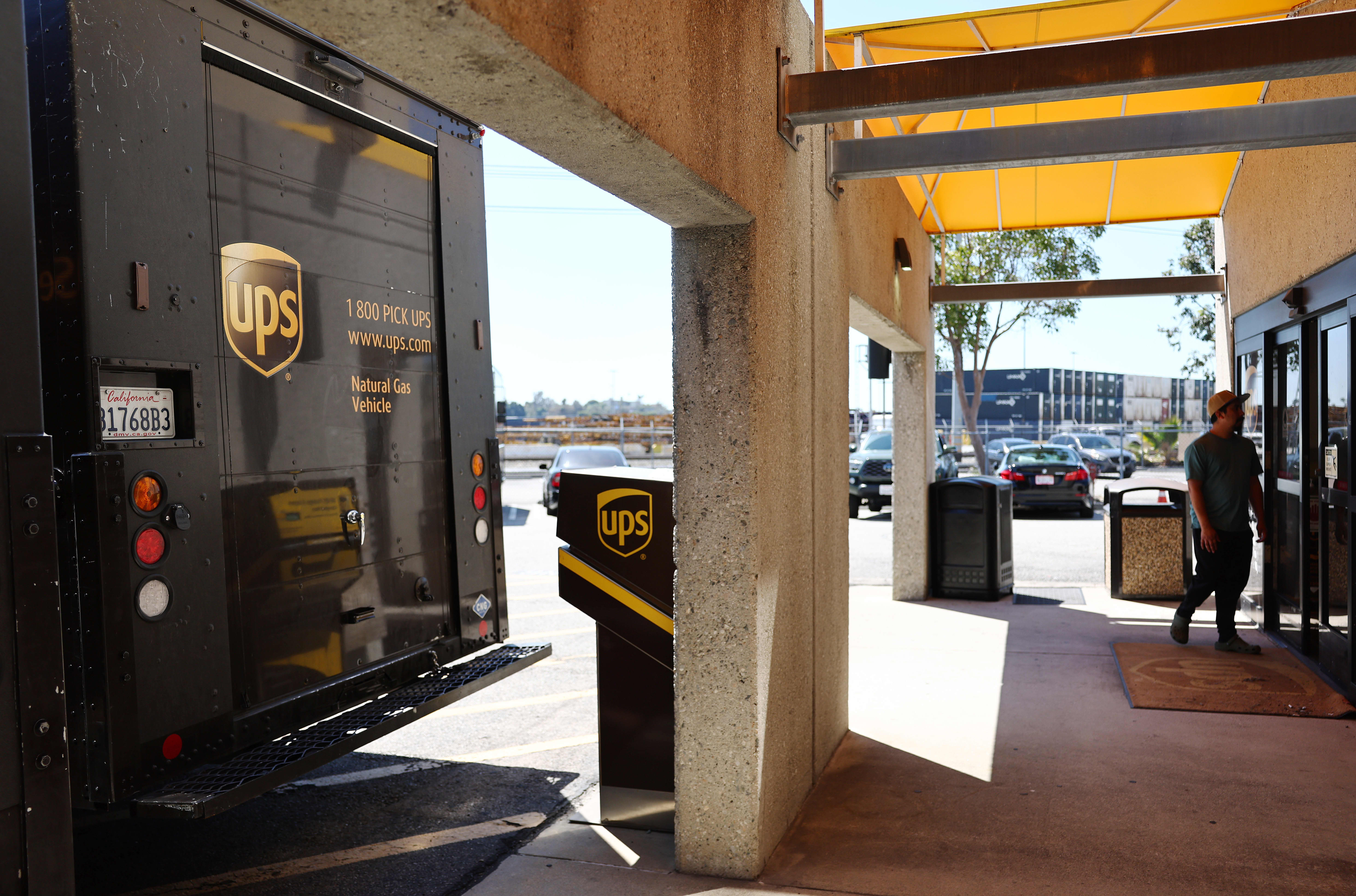 UPS reports earnings miss and cuts guidance.