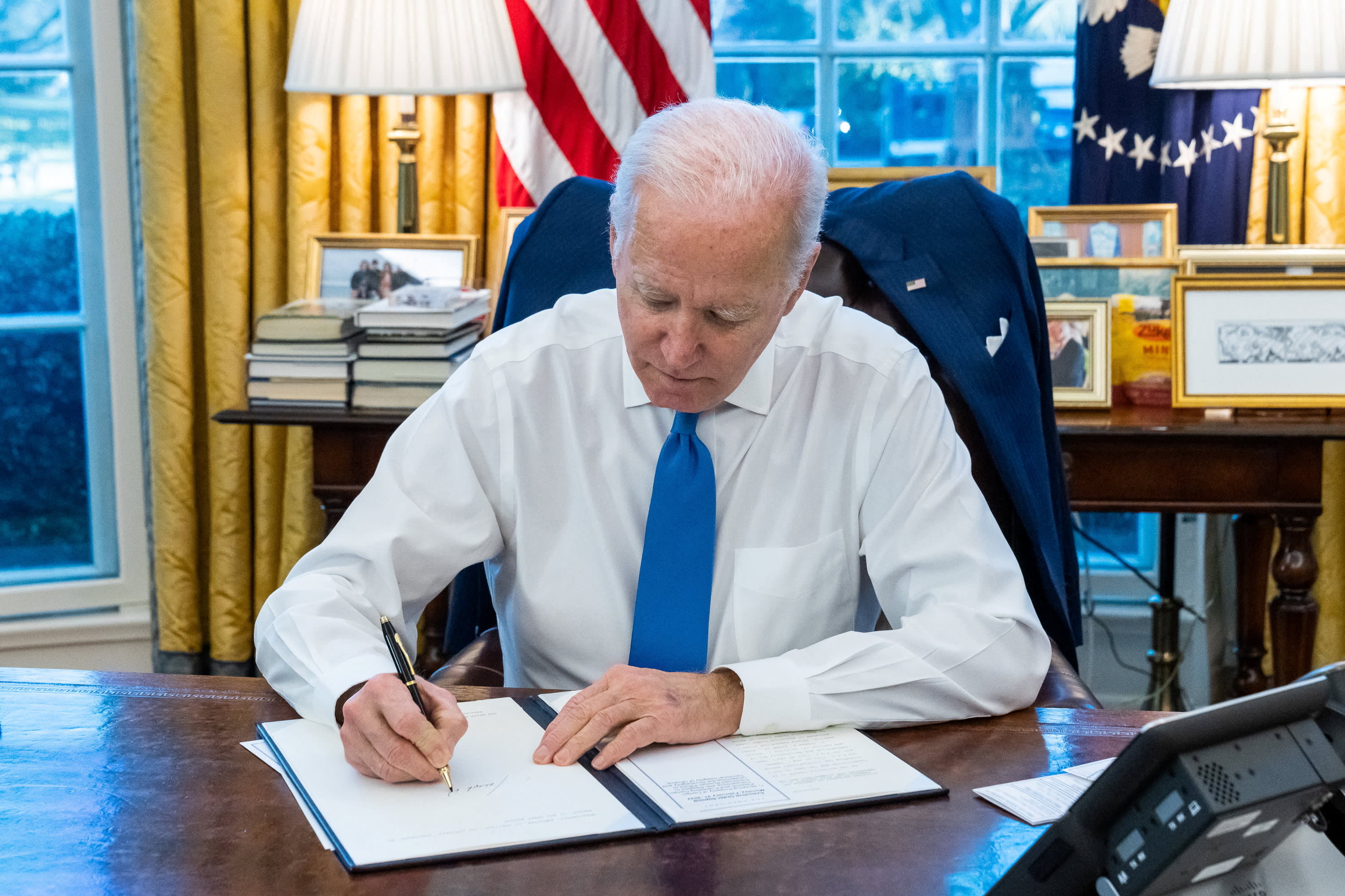 Biden imposes sanctions on separatist regions of Ukraine following Putin's decree, and the EU pledges further actions.