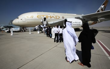 Etihad unveils $7 billion investment plan for retrofitting aging Boeing jets over five years.