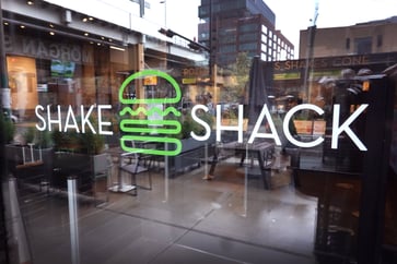 Fourth-quarter profit and strong 2024 outlook cause Shake Shack stock to increase by 26%.
