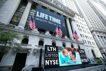 Life Time stock drops due to increased spending on luxury fitness experience.