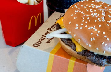 McDonald's to allocate over $100 million to accelerate recovery following E. coli outbreak.