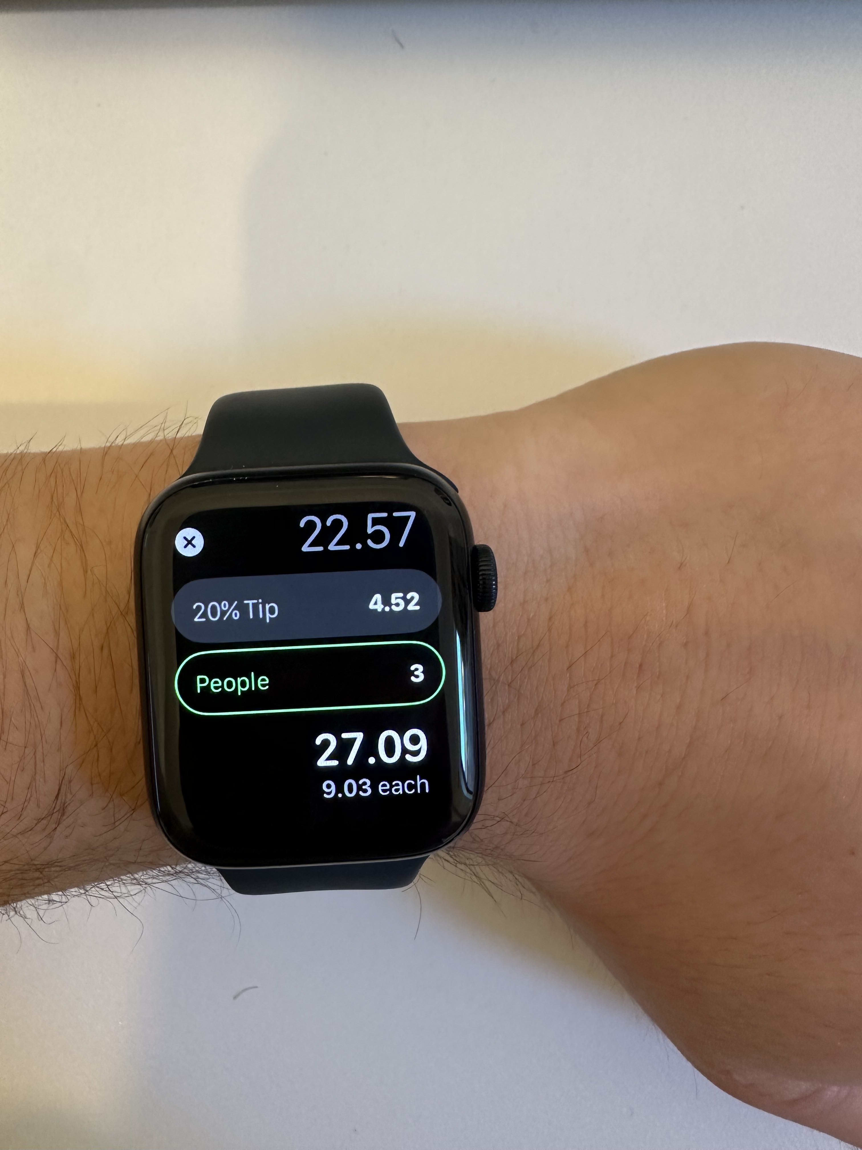 Calculating tips and splitting checks at restaurants using the Apple Watch.