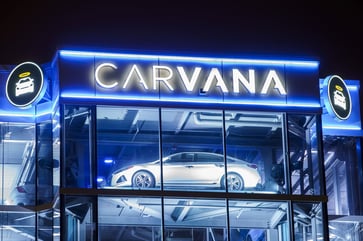 Carvana reports its first annual profit following debt reduction, shares soar.