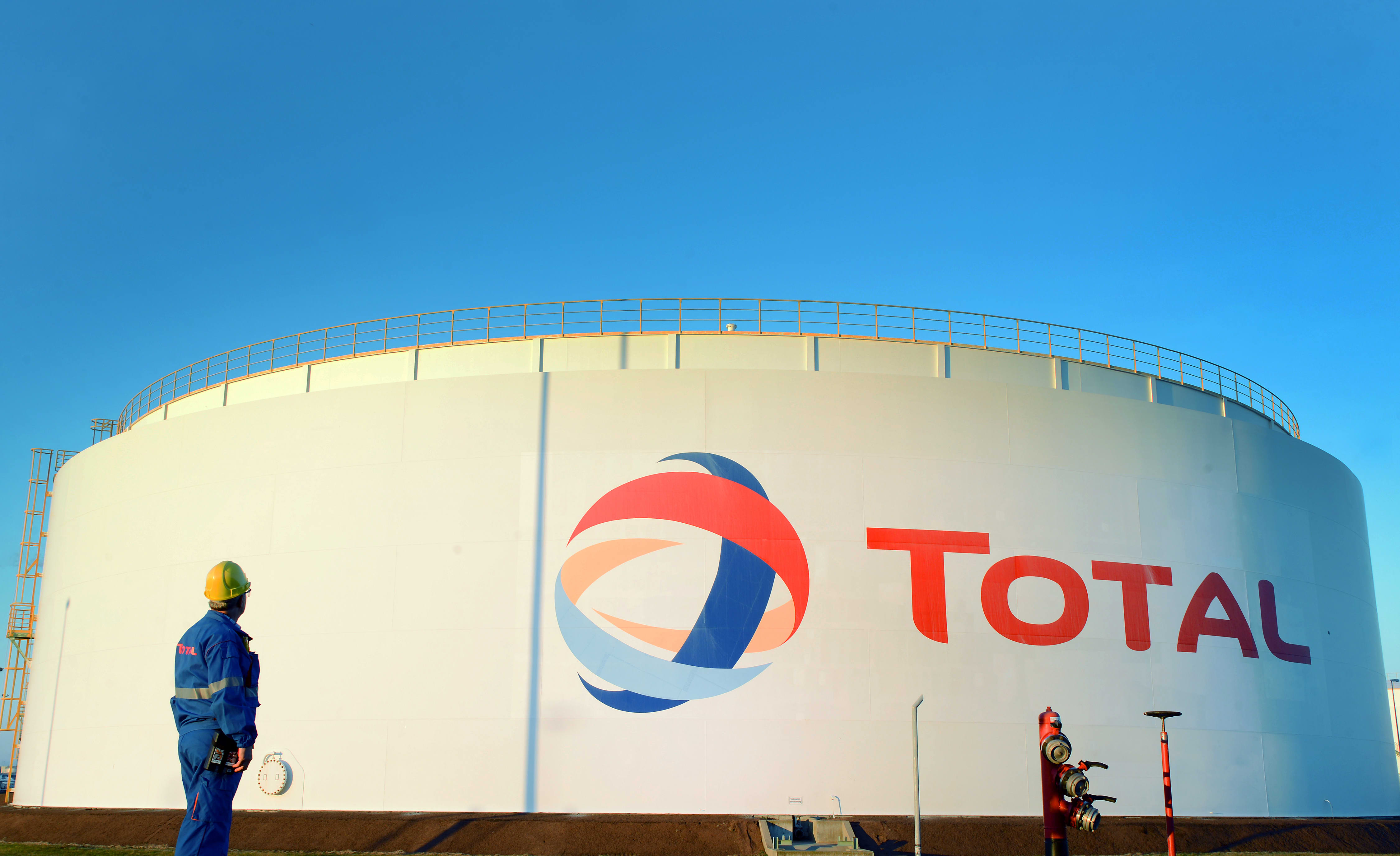 TotalEnergies CEO declines to collaborate with Putin again, yet maintains Russian investments.