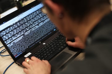 Ukrainian coders are dedicating their time to both work and cyber warfare.