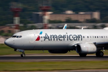 American Airlines adjusts 2024 profit forecast following sales strategy change.