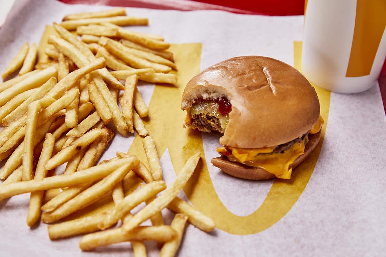 McDonald's and Wendy's are offering promotions for National Cheeseburger Day: McDonald's is selling 50-cent double cheeseburgers, while Wendy's is giving them out for a penny.