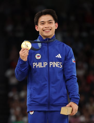 A 24-year-old gold medal gymnast from the Philippines will receive a condo worth $414,046, cash prizes, and other rewards.