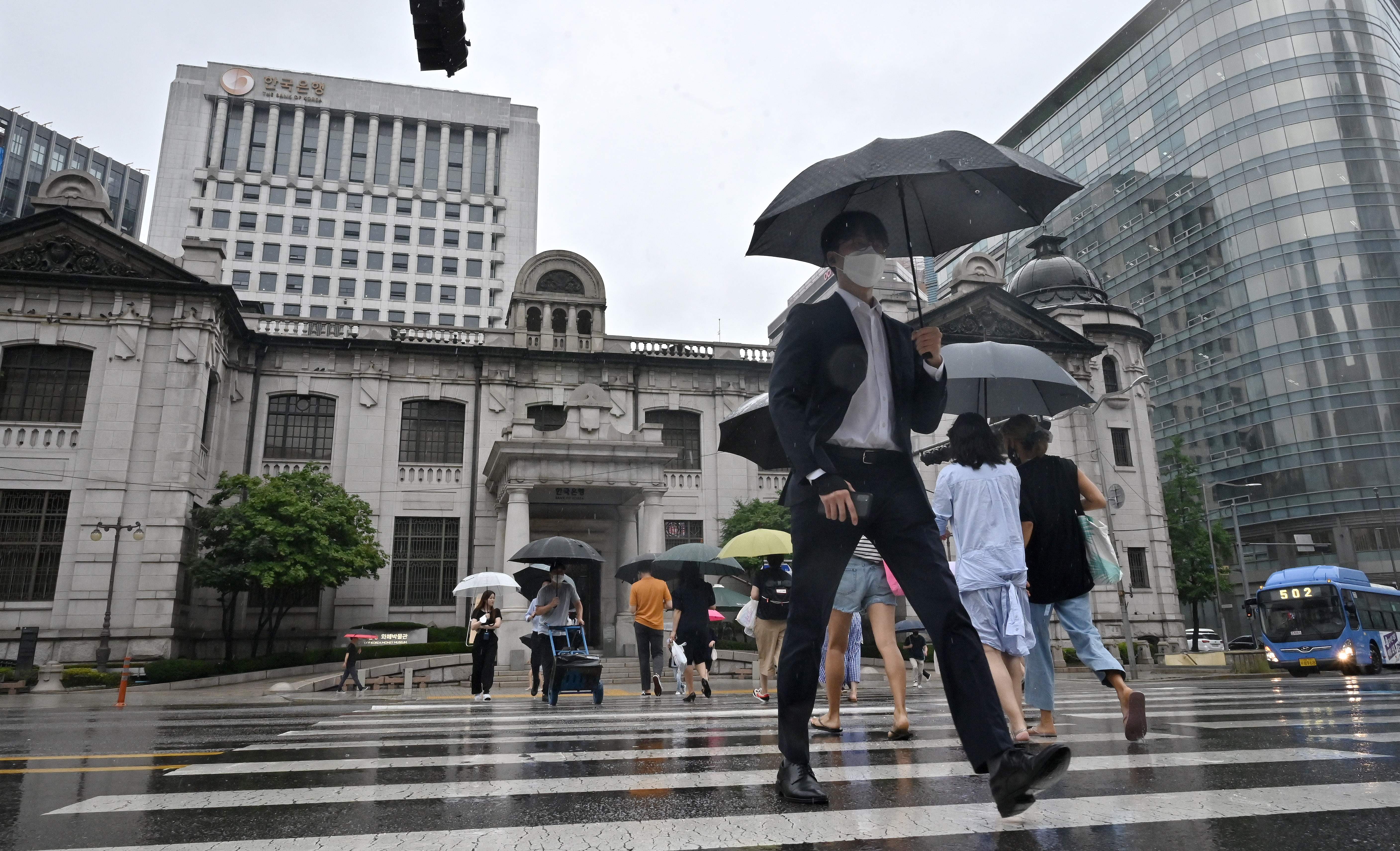 Bank of Korea reduces interest rates after maintaining them for nearly two years.