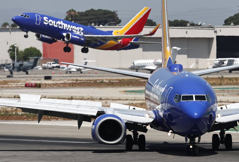 Southwest Airlines adjusts its summer revenue outlook and approves $2.5 billion in stock repurchases.