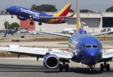 Southwest Airlines adjusts its summer revenue outlook and approves $2.5 billion in stock repurchases.