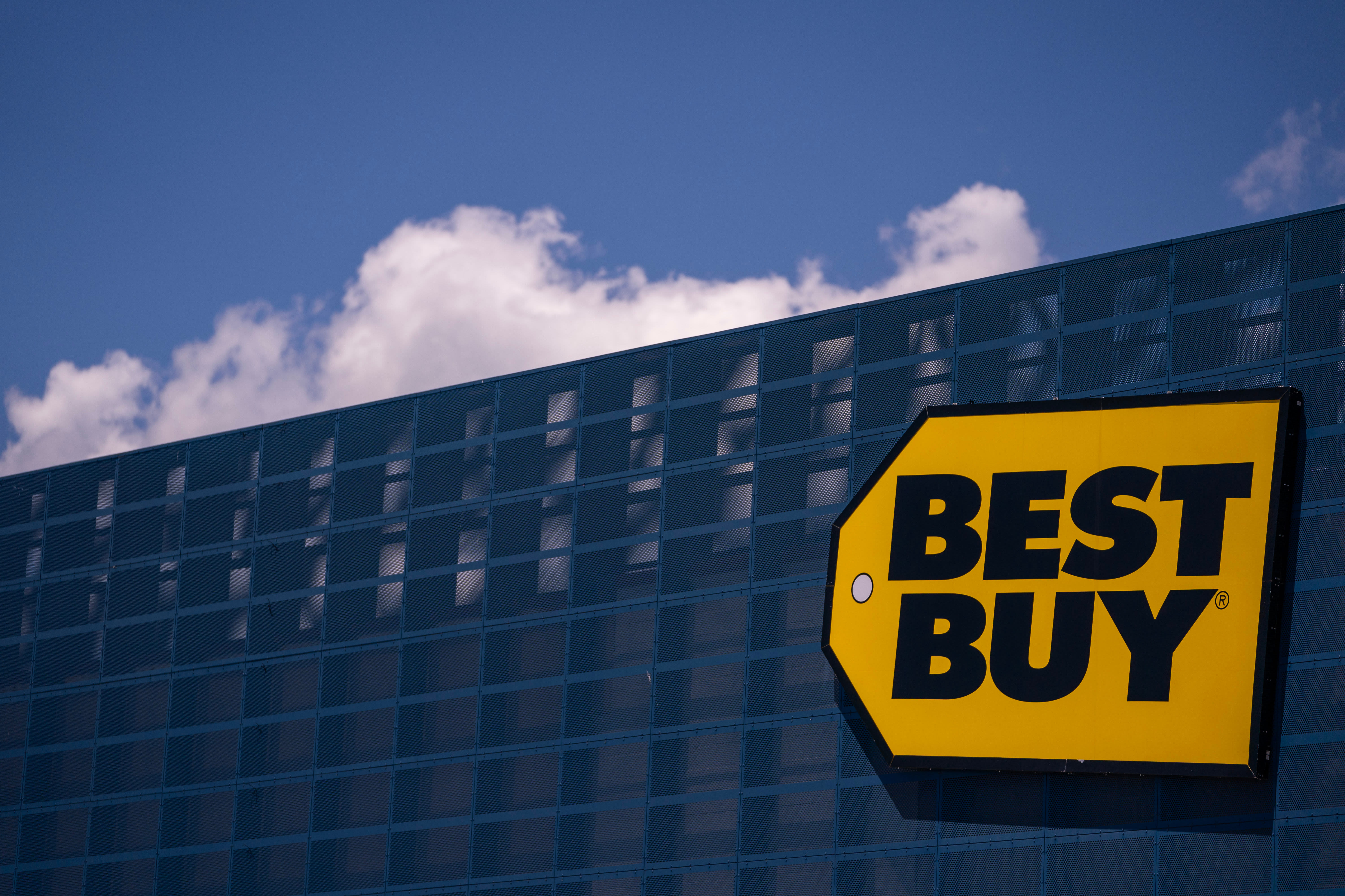 Consumer electronics demand remains soft, prompting Best Buy to lower its full-year sales forecast.