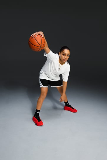 A girls' high school basketball player signs Adidas' first NIL deal.