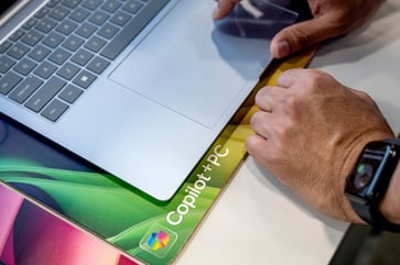 Corporate America is increasingly adopting Microsoft Copilot AI, but there is still some hesitation.