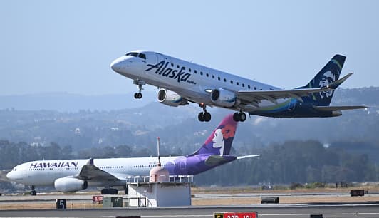 The merger between Alaska Airlines and Hawaiian Airlines has been approved by the Justice Department, but still needs to be reviewed by the Department of Transportation.