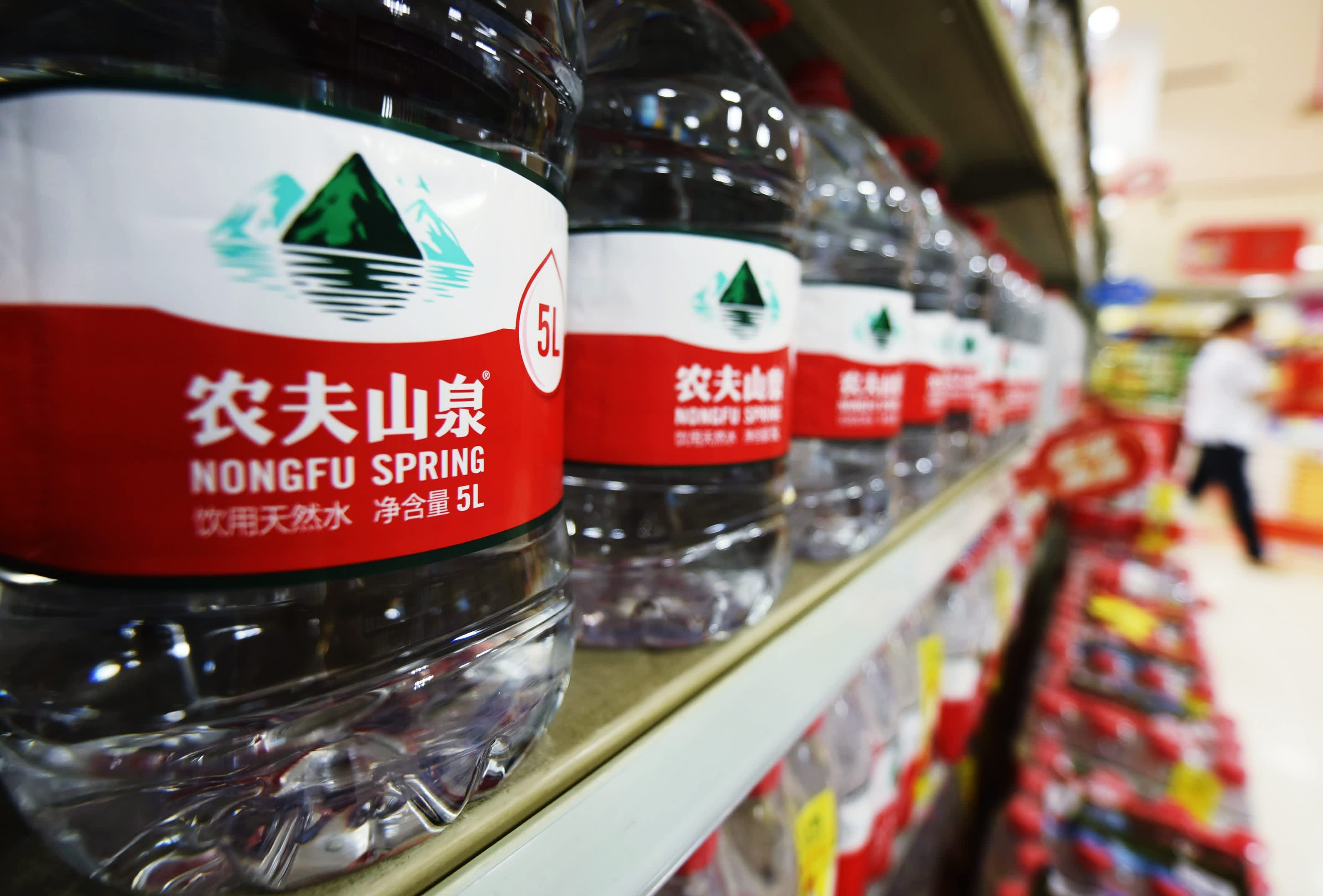 Nongfu Spring's shares plummet by more than 12% after the beverages manufacturer reports a decrease in profit growth.