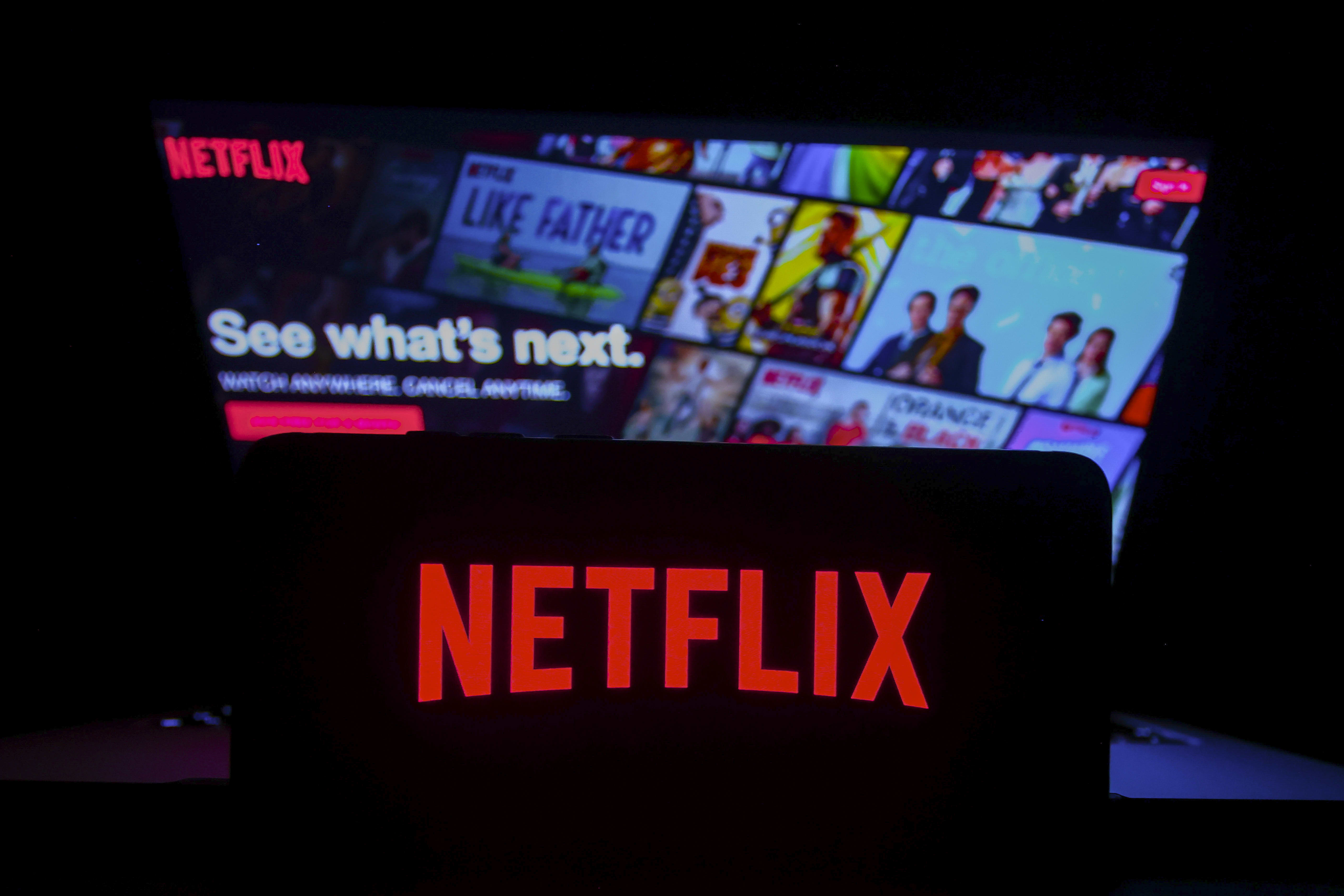 Netflix's stock price rises as the company announces increasing revenue and over 300 million subscribers.