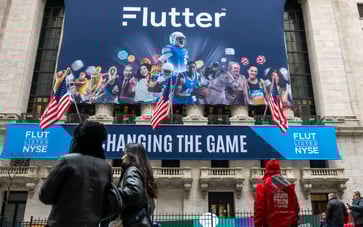 Flutter, the parent company of FanDuel, lists on the NYSE, positioning itself as a sports-betting pure play competitor to DraftKings.