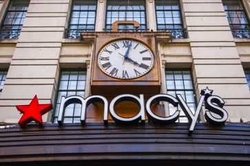 Department stores are struggling to attract customers, causing Macy's to lower its sales projections.