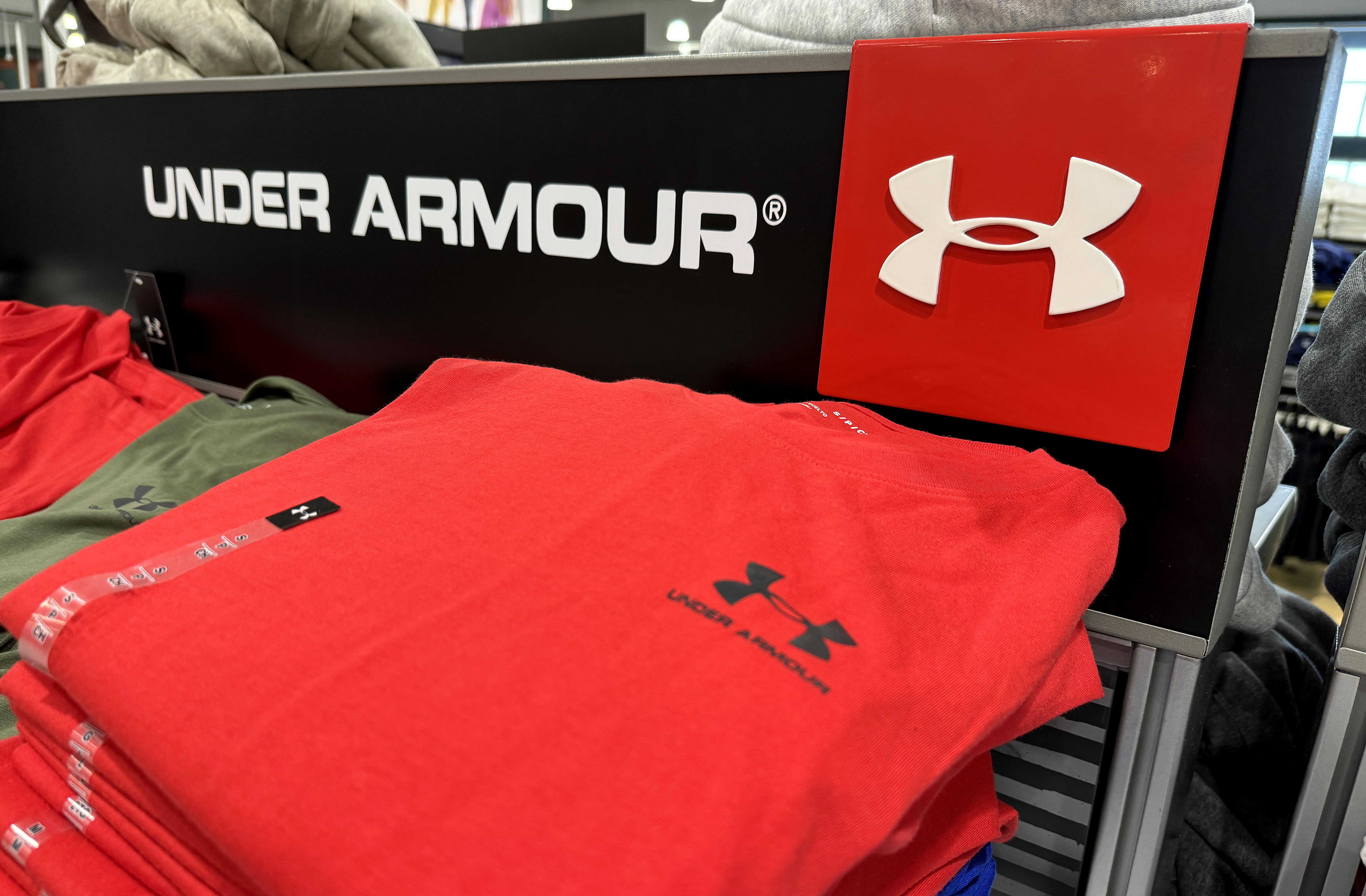 Retailer's decision to reduce discounts and promotions leads to decline in Under Armour sales.