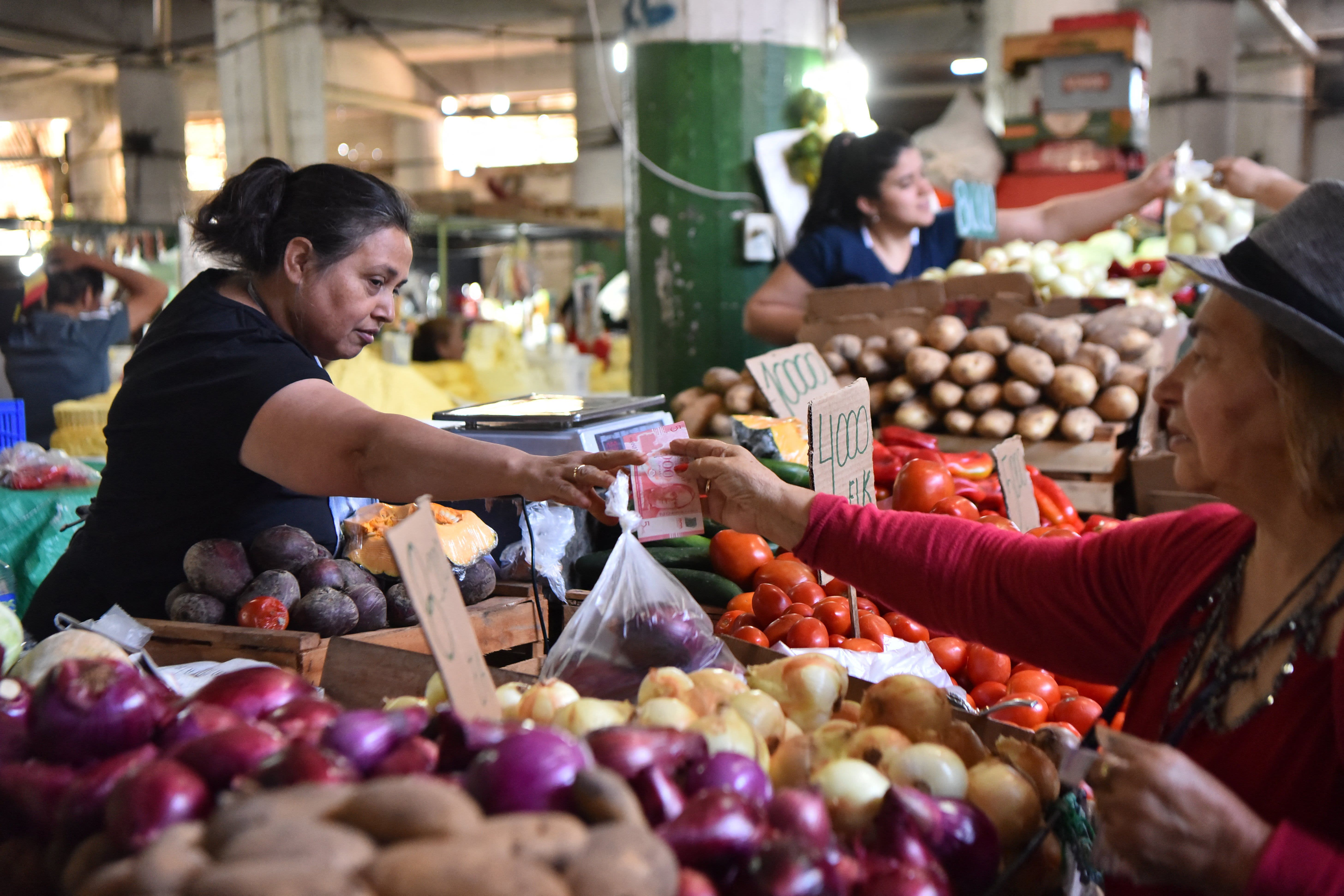 The International Monetary Fund raises its global growth forecast due to decreasing inflation and unexpected increases in household spending.