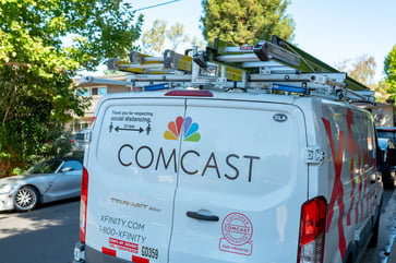 Comcast's stock price drops as executive admits broadband market is highly competitive.