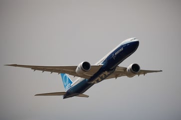 One 777X aircraft's structure was discovered to have damage, prompting Boeing to halt tests.