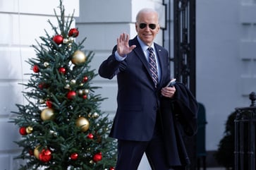 Despite a decline in approval for President Biden, holiday spending is expected to increase, according to a CNBC economic survey.