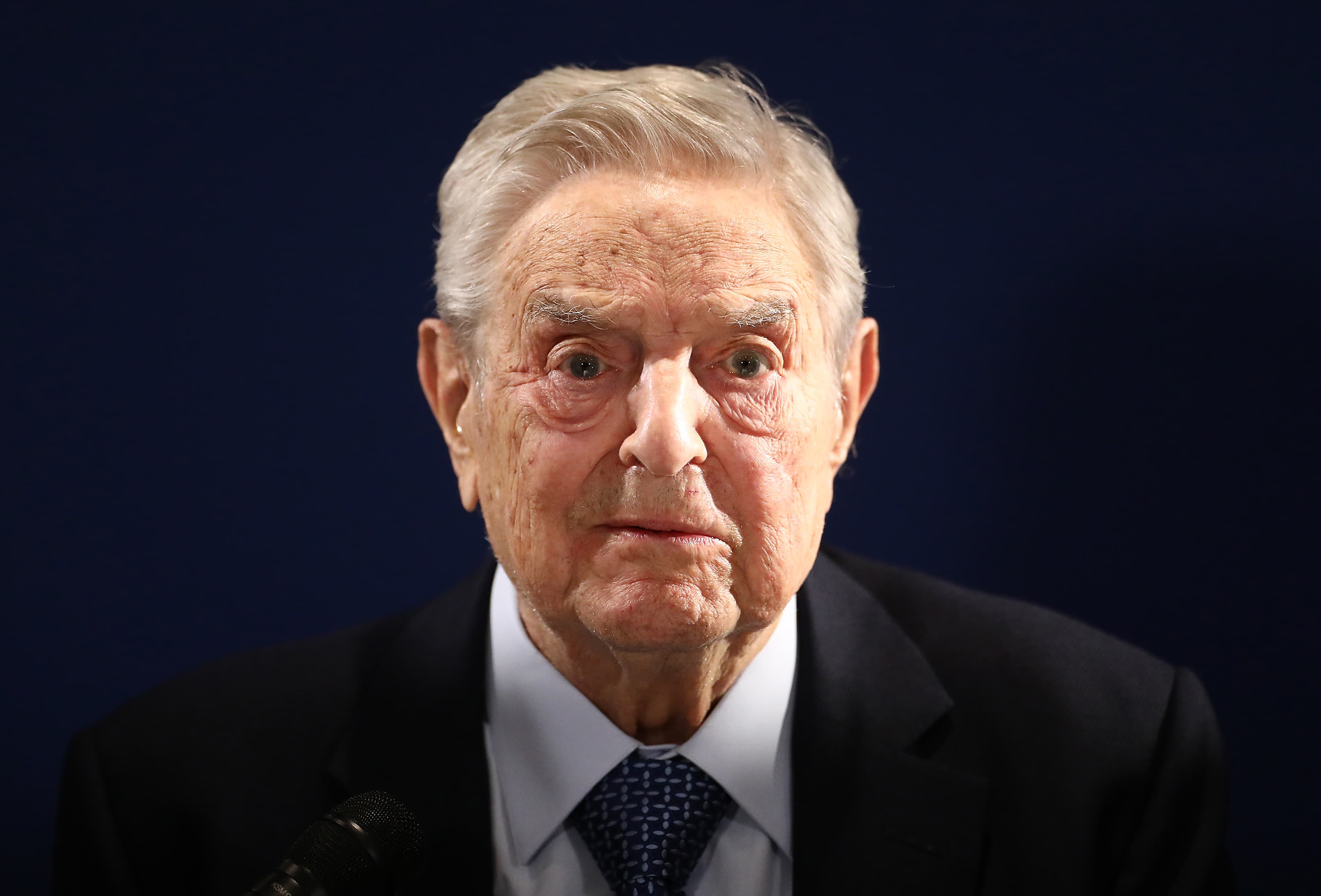 The leadership of China's Xi is being threatened by the omicron outbreak and real estate crisis, according to George Soros.