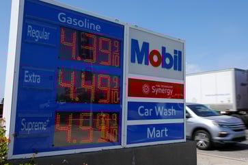 Exxon Mobil's fourth-quarter earnings surpass expectations due to rising oil and gas prices, causing shares to increase.