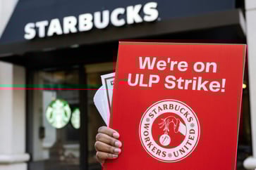 Starbucks' union strategy criticized by labor coalition, potentially harming shareholder value.