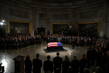 A man was arrested while attempting to enter the U.S. Capitol with a machete, coinciding with the lying in state of former President Jimmy Carter.