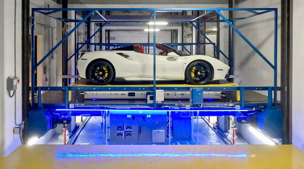 Your car is valet parked by robots in a high-tech parking garage.