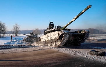 Russia announces partial withdrawal of troops from the Ukraine border, while NATO advises caution.