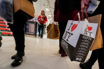 This holiday season, shoppers are planning to spend more, but also accrue debt.