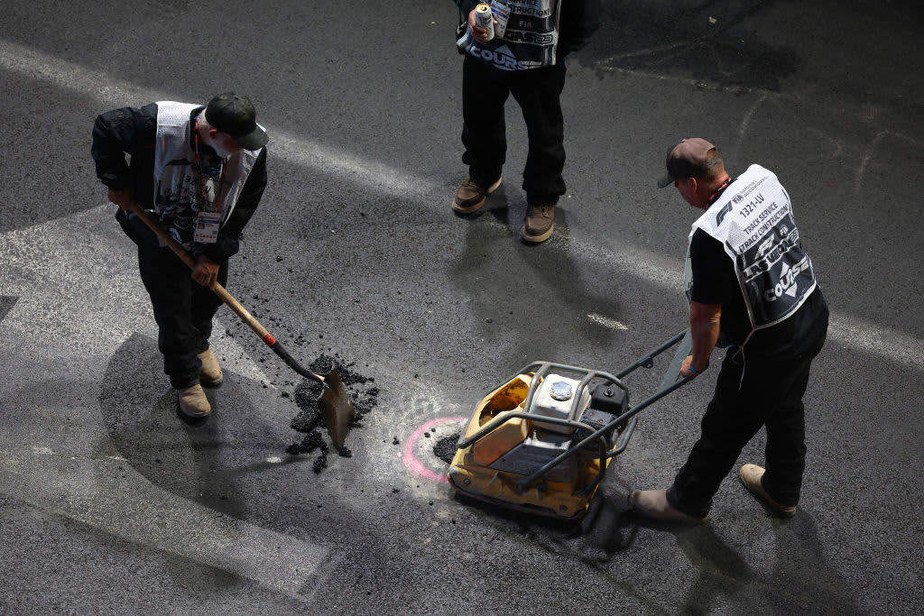 Carlos Sainz's car is damaged in the first practice session of the Las Vegas GP after a manhole cover falls onto the track.