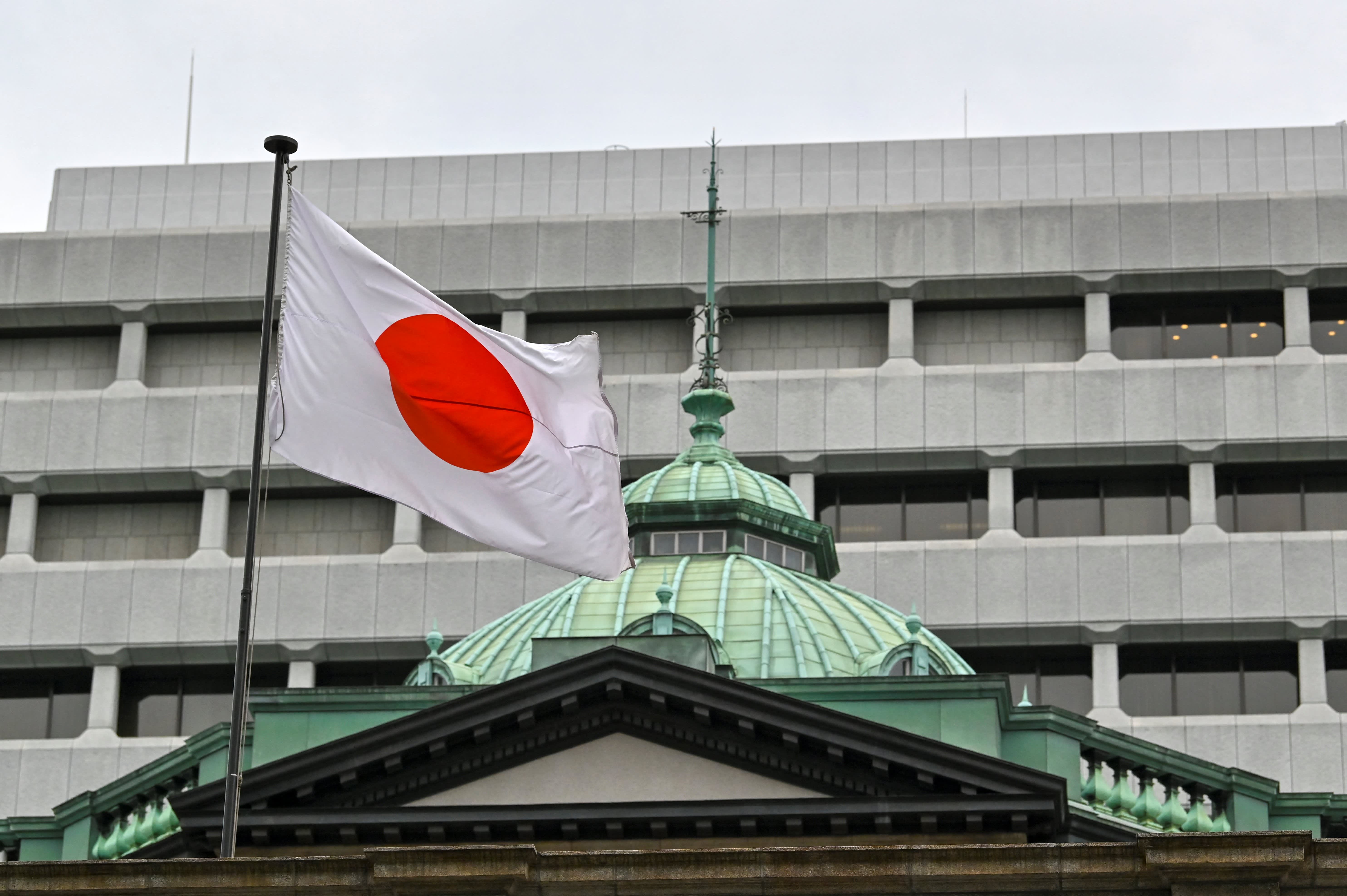 The Bank of Japan maintains its benchmark interest rate while proceeding with caution in normalizing its policy.