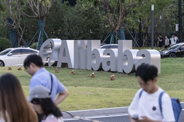 Despite cloud acceleration, Alibaba experiences a 4% premarket dip in stock price after missing earnings expectations.