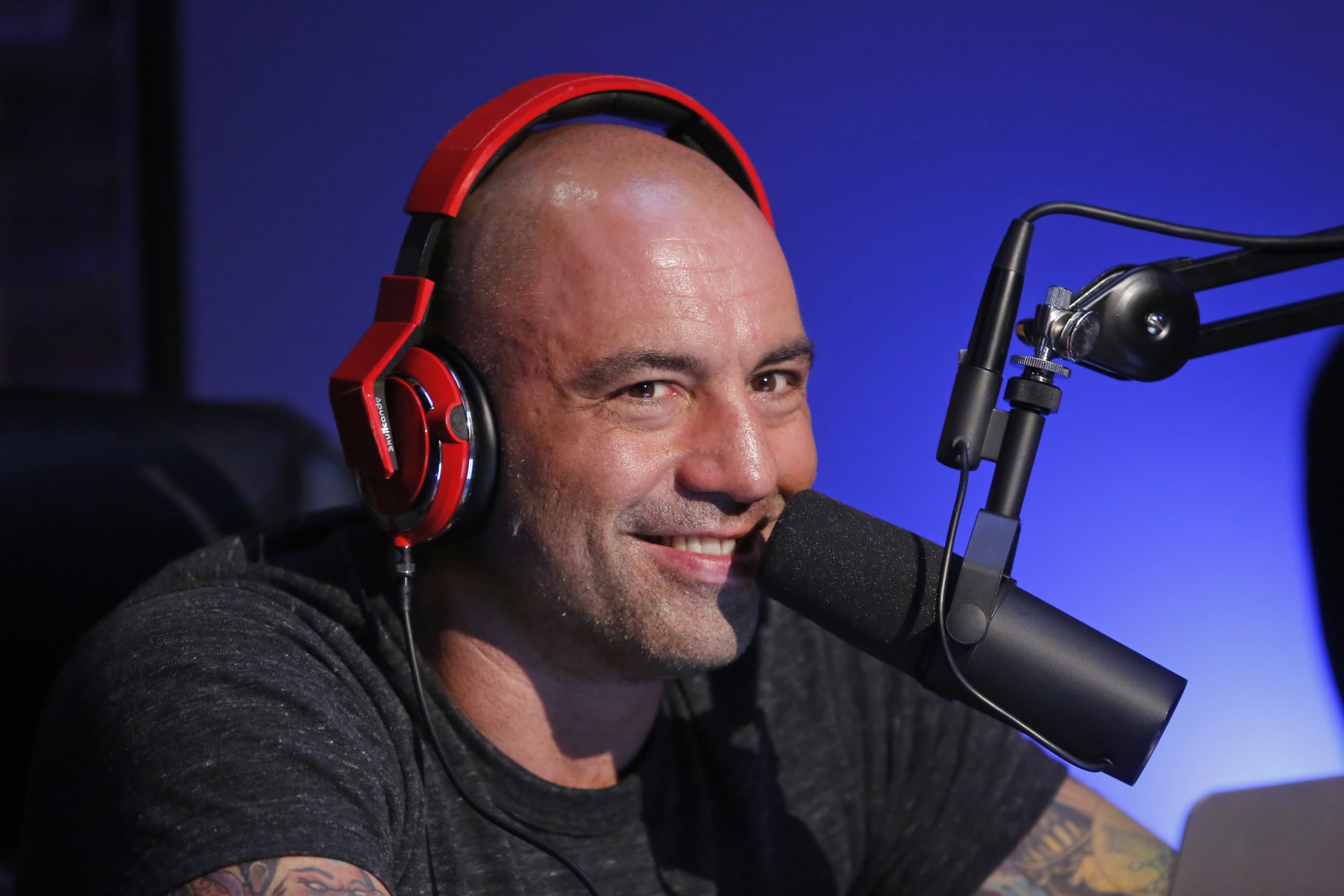 Podcaster Joe Rogan renews deal with Spotify, expands show to other platforms.