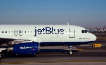 JetBlue, Eli Lilly, Occidental Petroleum, and other stocks experiencing significant price changes during the midday trading session.