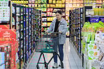 Despite trade war concerns, China's consumer prices rise less than anticipated due to slowing economy.