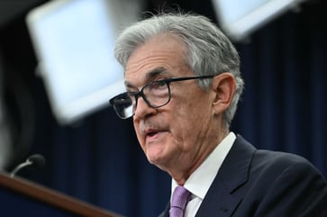 Jerome Powell delivers a speech at the Dealbook conference.