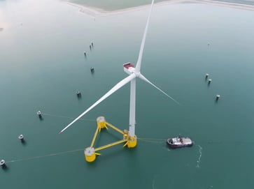A record $4.37 billion was raised in an auction for the right to construct wind farms off the coasts of New York and New Jersey.