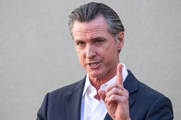 Gov. Newsom emphasizes California's efforts in combating climate change beyond mere words.