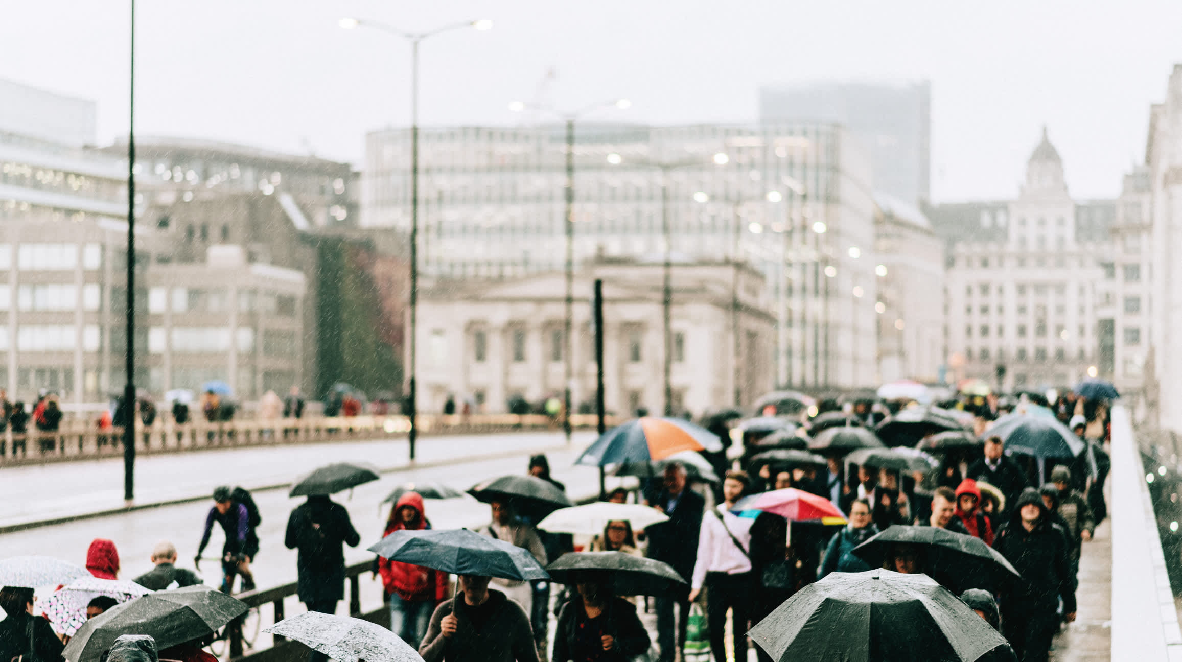 In April, the UK economy experiences a slowdown due to damp weather impeding consumer spending.