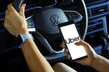 Uber displays average wait time and ride expenses in thousands of cities.